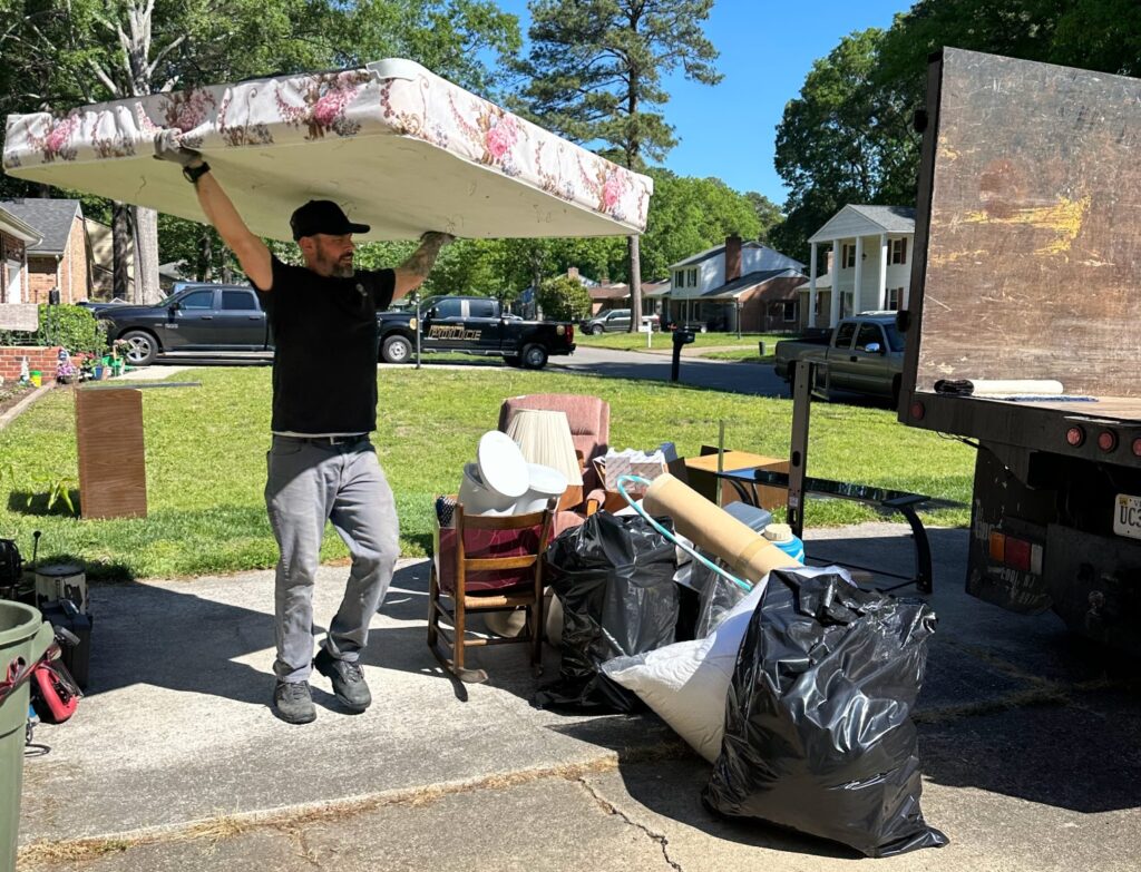 Crew removing old mattress in Chesapeake VA
